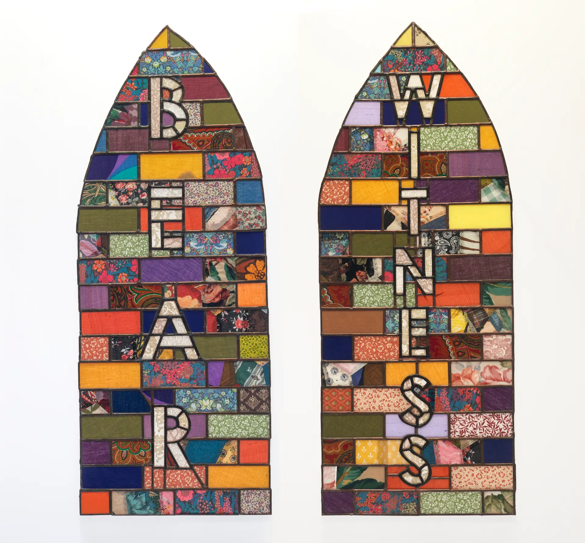 2 stained glass plinths with Bear and Witness on them with coloured panels
