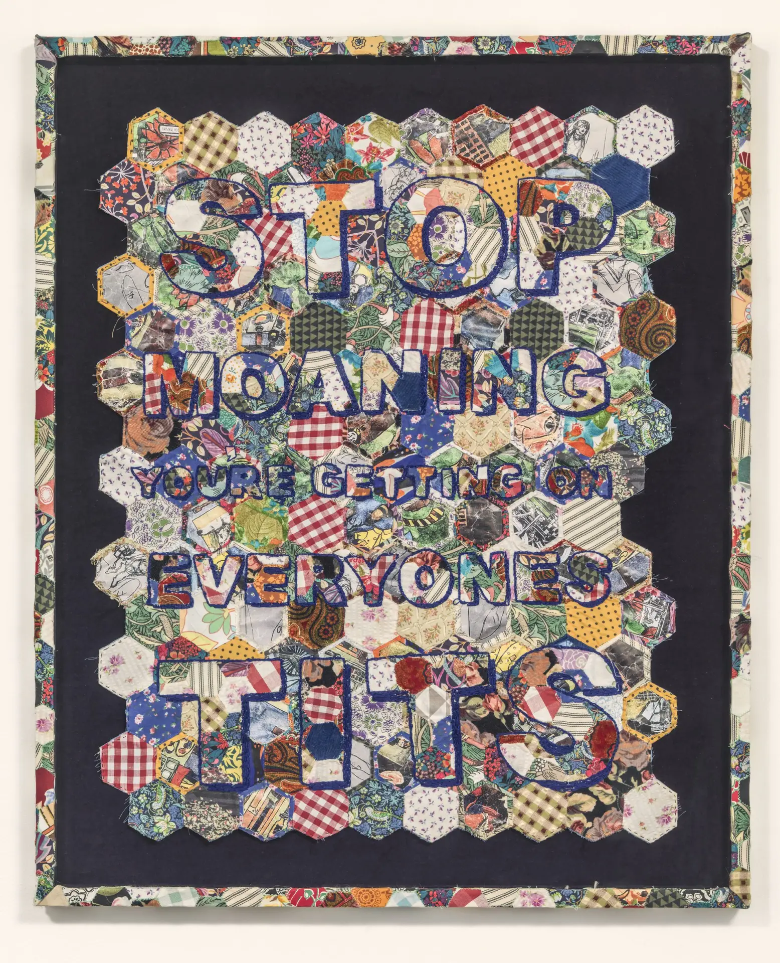 Large patch work with bold text emblazoned across it